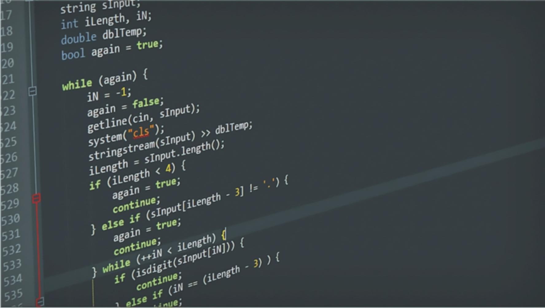 Close-up of hands typing code on laptop with multiple browser windows open for testing